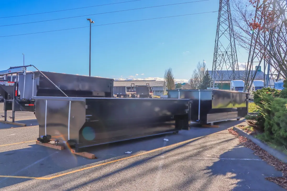 Roll-off dumpster ready for waste disposal at job site for 6 Yard Dumpster Rental in Avon